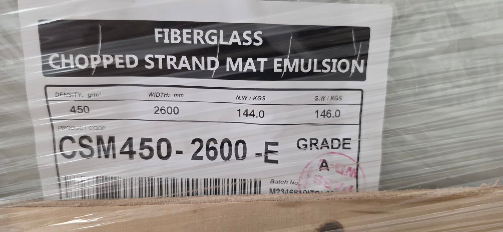 Product label showing net weight 144 kg and gross weight 146 kg per roll
