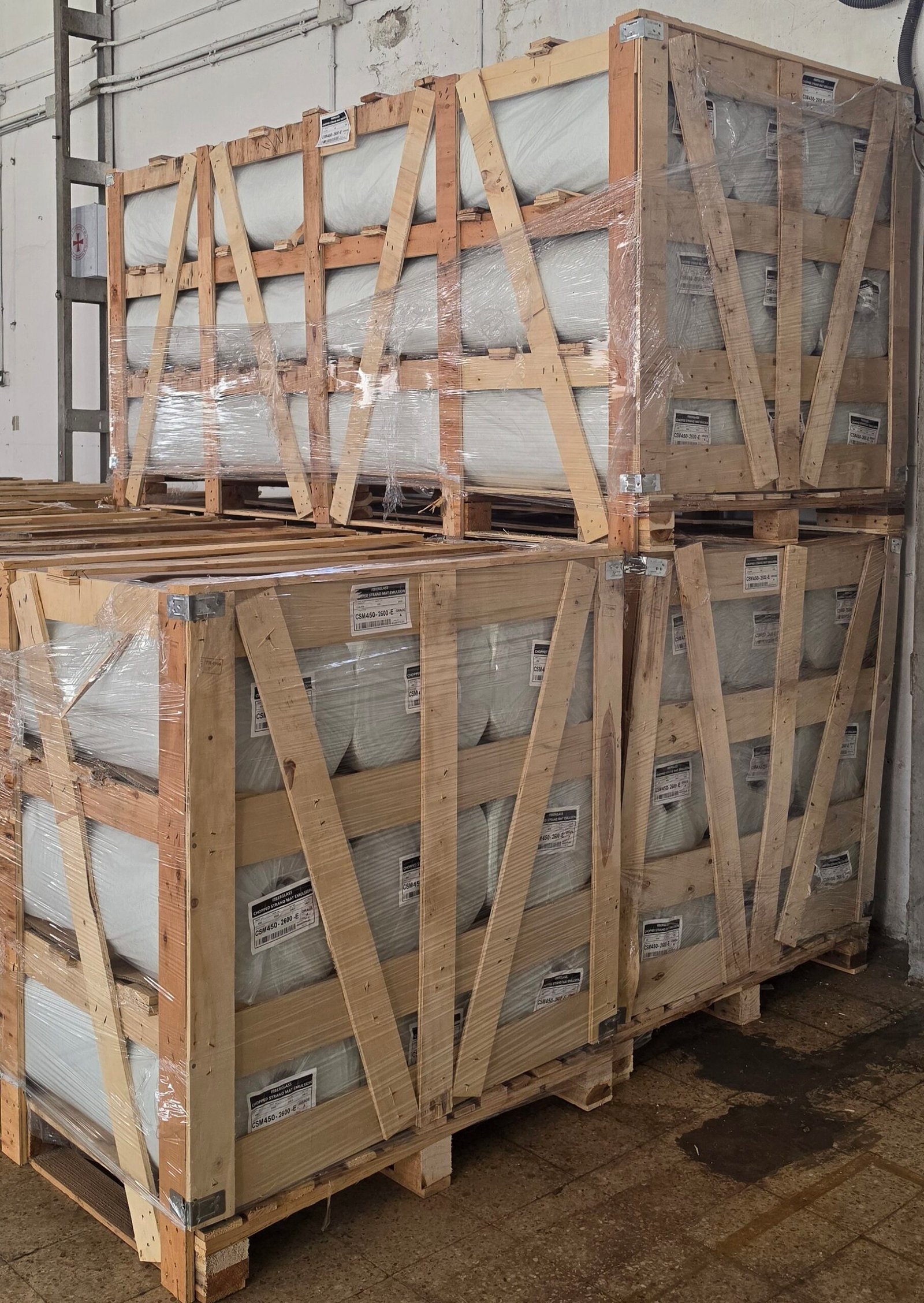 Fiberglass mat roll pallets in warehouse