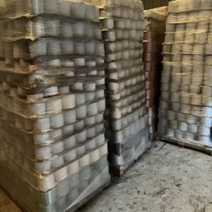 Pallets of glazed stoneware flowerpots wrapped in plastic, warehouse
